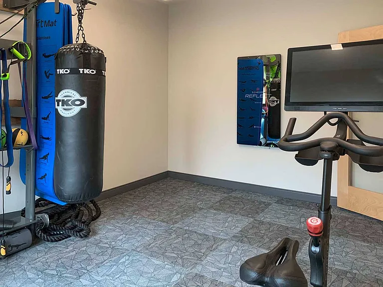 Enjoy a guided workout? Our yoga and spin area includes an Echelon bike and fitness mirror.