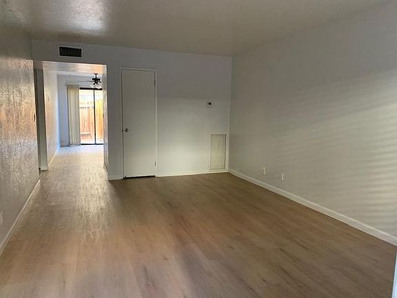Living room looking in to kitchen/dining