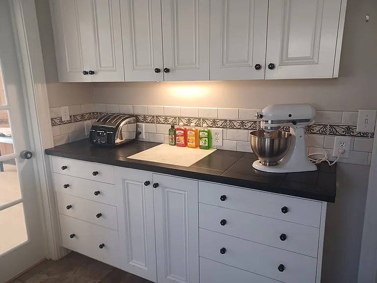 Baking nook with storage; includes KitchenAid mixer, Avanti toaster, and 3-way coffee maker.