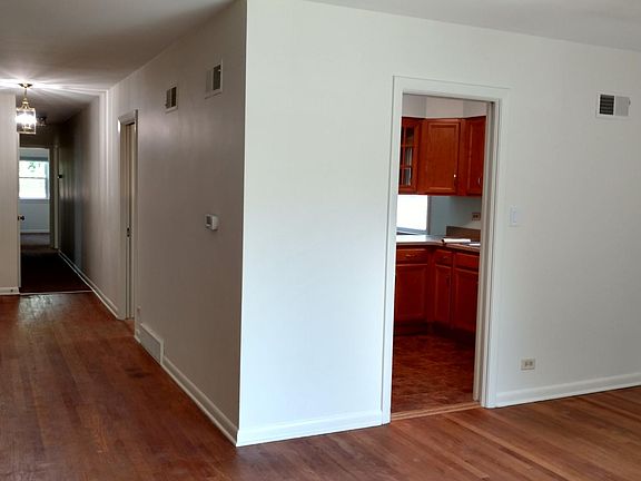 looking north toward the hallway and the kitchen from the living room