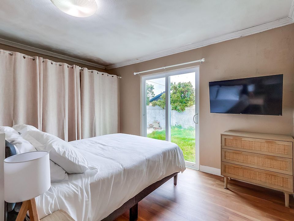 New queen bed with view of backyard