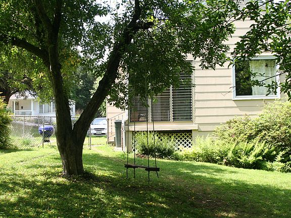 screened in porch overlooks back yard