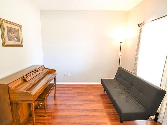 Living room/ study has glass double doors Brazilian wood floors lots of light