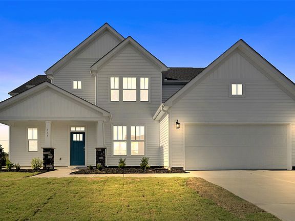 2 story single family home, all white with a 2 car garage
