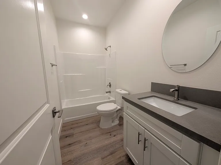 Bathroom #2 with shower over tub and large vanity/sink