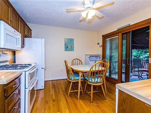 Eat in kitchen has plenty of cabinets for storing all the ingredients you'll need for family meals and holiday gatherings.  Slid