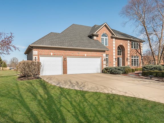 Concrete driveway into a 3 car garage with the 3rd bay separated to contain your hobbies!