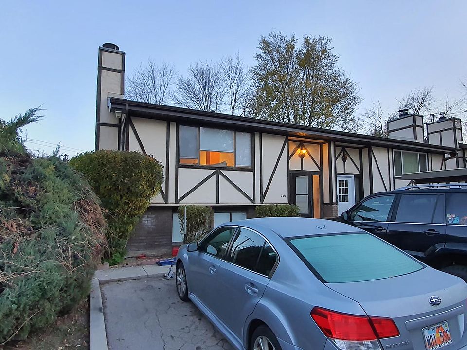 Front of house w/ 2 parking spots, plus a guest parking spot.