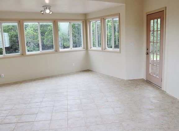 Large oversized room between garage and main house.  Could be used as craft room, office or another living area.