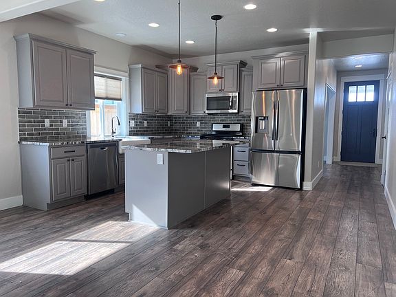 Large kitchen with island and breakfast bar.