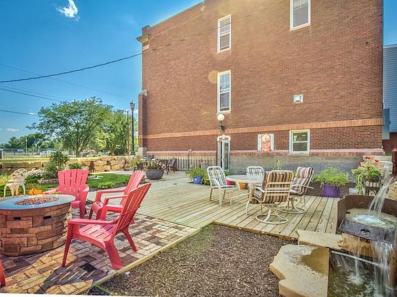 Patio area with gas fireplace and grill