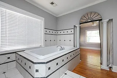 Mediterranean Columns with Curtains to close off Master Bath. 2nd closet is on the right, across from the Jacuzzi.