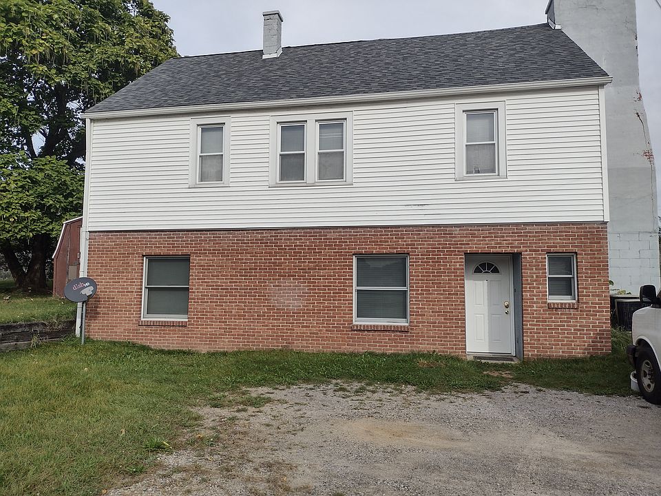 Outside of Apartment & Parking Area - Lower Apartment (Brick)