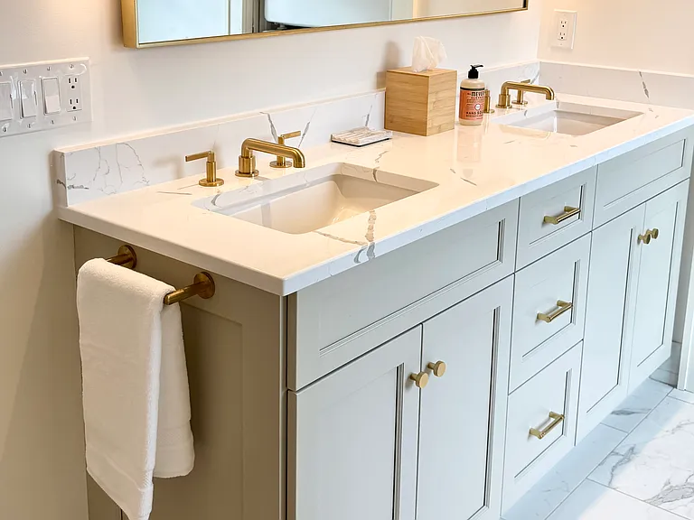 Master bathroom with walk-in shower and front-load washer/dryer