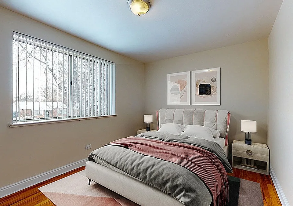 Inviting bedroom with modern decor, cozy natural lighting, and elegant artwork, perfect for relaxation.