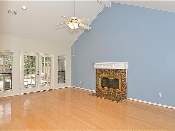 This family room is huge! With cathedral ceiling and windows on both the front and back of the home, allowing in lots of natural light!