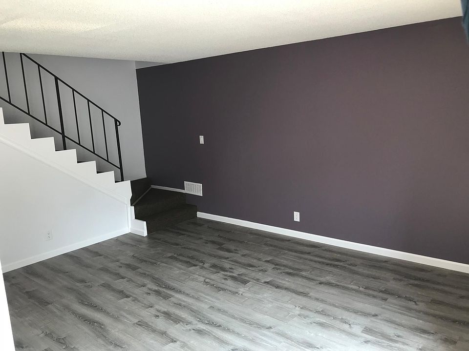 Living room with stairs to the second floor 