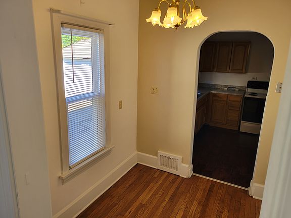 Breakfast nook leading to kitchen and new window.