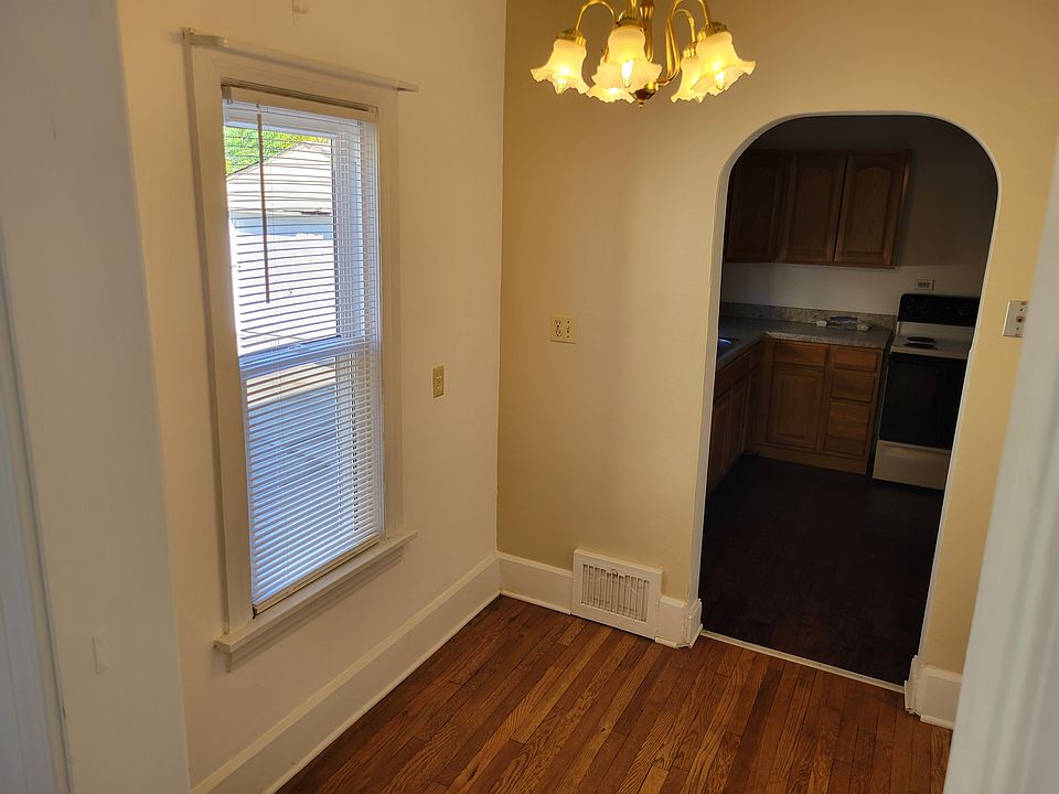 Breakfast nook leading to kitchen and new window.