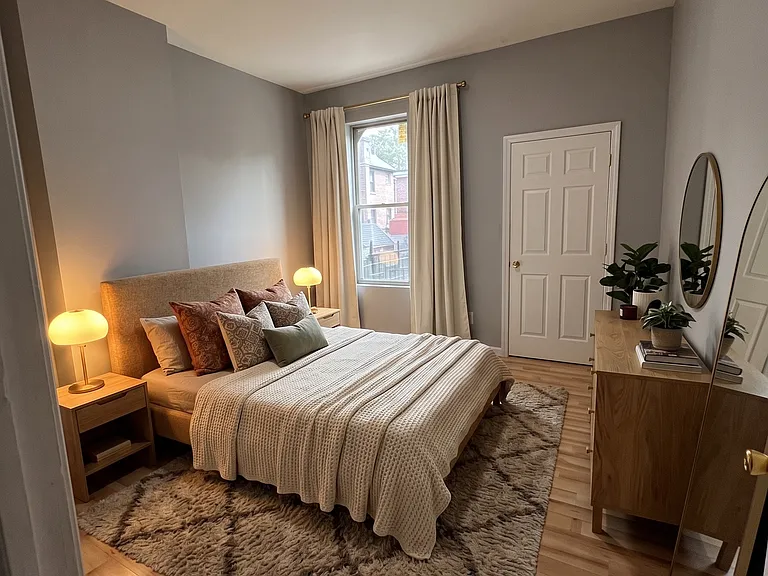 Bedroom- This room has been virtually staged using AI to help visualize its layout and design potential.