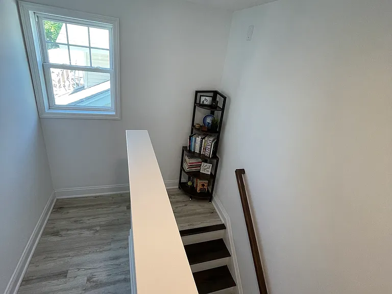 2nd floor landing area leading to two guest bedroom and a full, guest bath