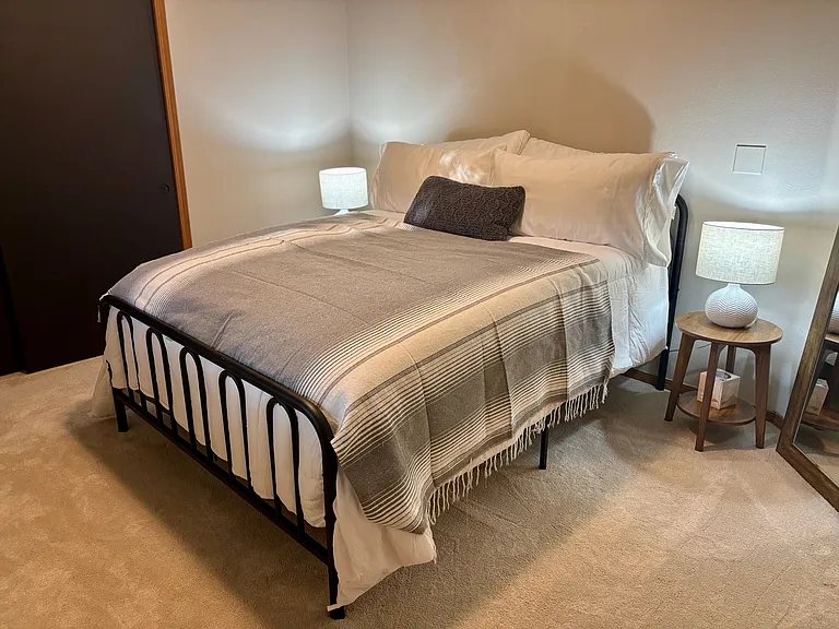 Bedroom #2 with queen bed and 55" TV. Chalkboard closet doors for your creative inspo!