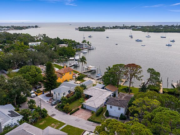 Nestled on a secluded private drive along Big Bayou, the home offers panoramic views of a serene estuary, where sailboats drift through protected open waters with direct access to Tampa Bay.