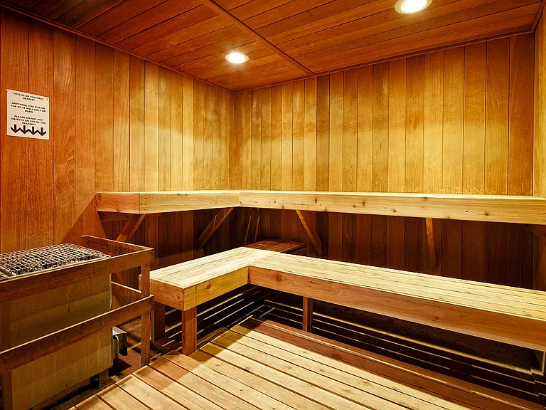 Experience the ultimate relaxation in this luxurious wooden sauna, designed for comfort and tranquility.