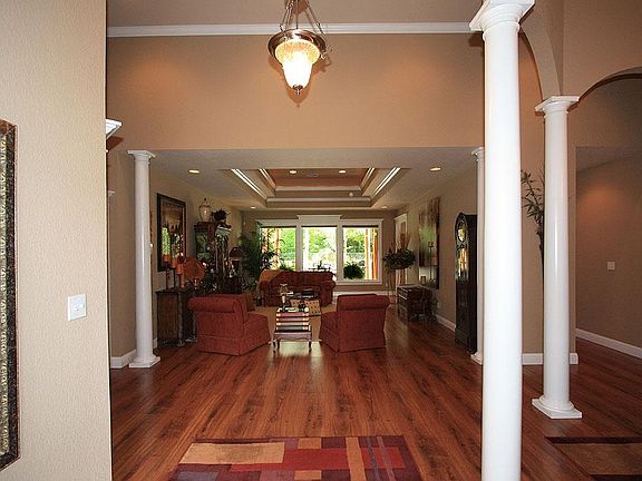 These wide plank wood floors are absolutely stunning!  Pay attention to all the architectural detail and interest with the stair stepped "Great Room"/Family Room ceiling, crown moulding, columns and recessed lighting.  This Dream Home can be yours!