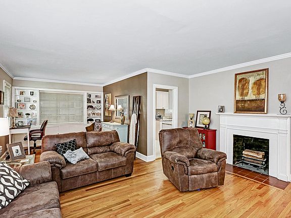 Gas fireplace adds ambience to living room.