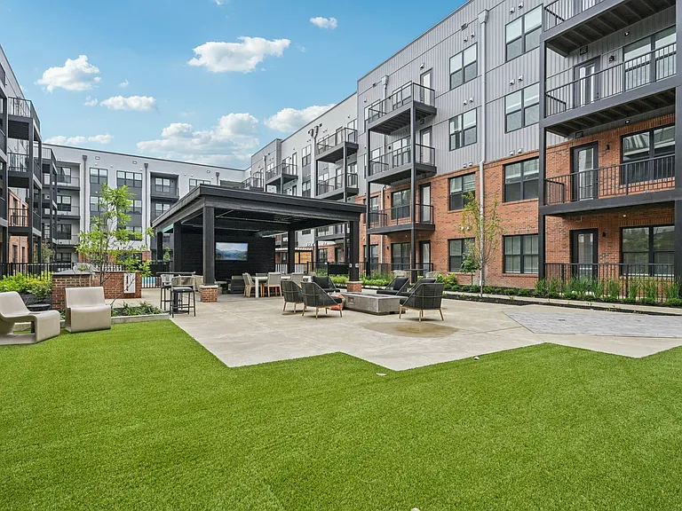 Courtyard with greenspace and TV's for residents.