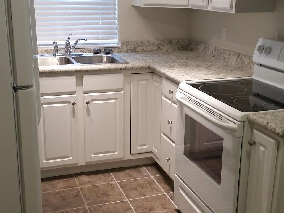 Newly remodeled kitchen with energy efficient appliances and ceramic tile flooring.