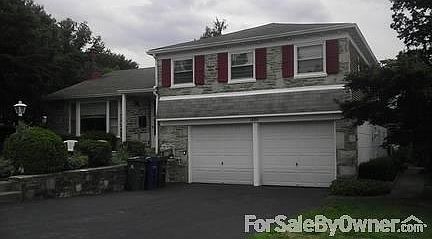 Full Stone Front And 2 Car Garage