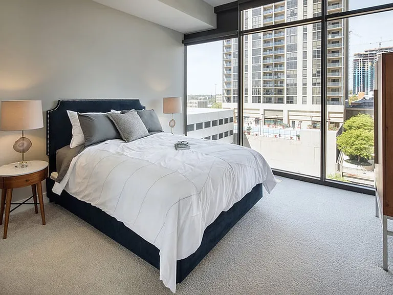Bedrooms with oversized windows, 10 ft ceilings and natural light