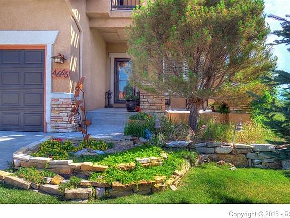 The front door and porch entrance to the home.