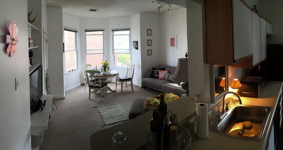 Kitchen looks out at living room