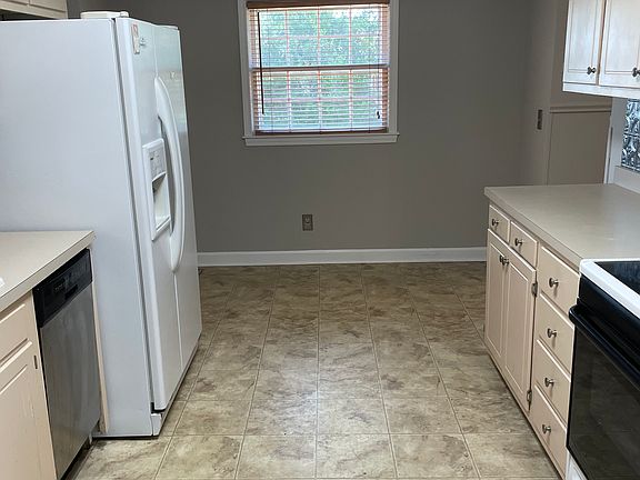 Eating nook by the window. Perfect for a small table with stools.