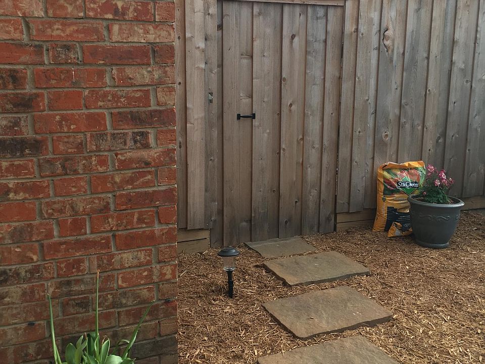 Entry into a private yard. Leads to a covered patio.