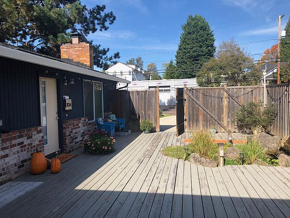 private, fenced courtyard with pond