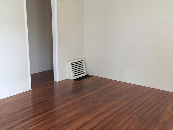 Living room leading to hallway and bedrooms