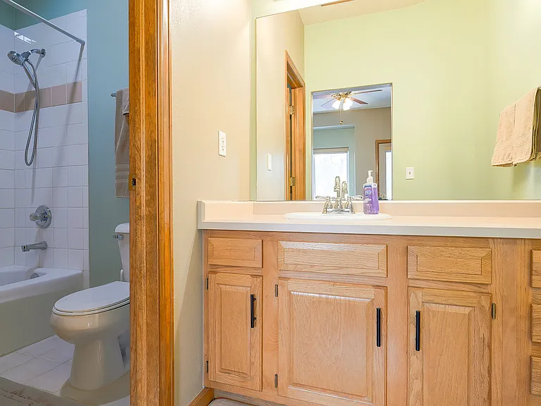 Third floor bedroom with private vanity and bathroom