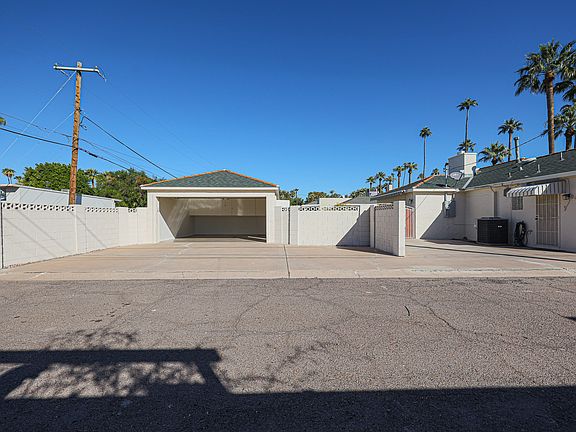 Outside: Alleyway access to garage, back door