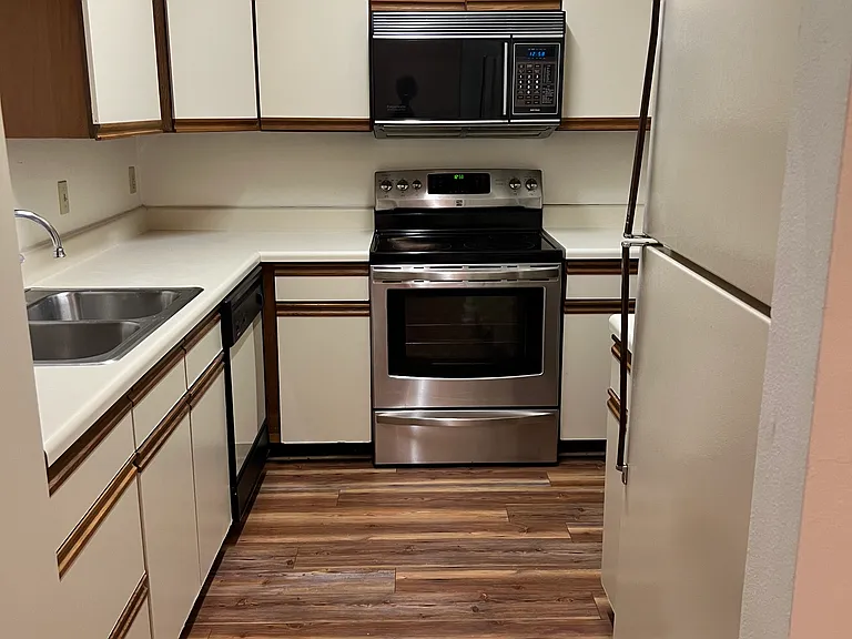 Kitchen with full utility room on right