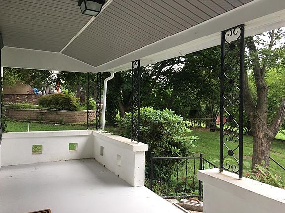 Front Porch looks out to large yard