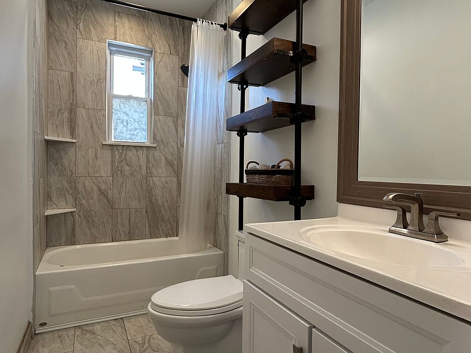 Completely remodeled bathroom with ceramic tile and all new plumbing (water lines and drains), and Bluetooth LED light/fan.