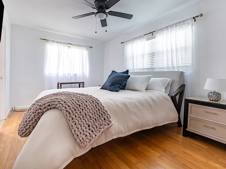 The master bedroom comes furnished with a king-size Dream Cloud mattress and nightstands.