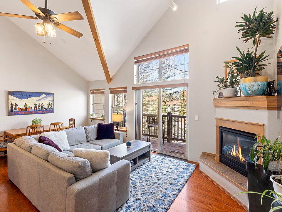 Spacious living area with vaulted ceilings and natural light