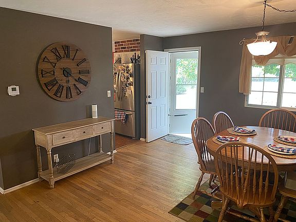 Dining opens to kitchen/hall