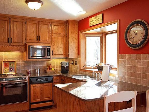 New granite, stone back splash, improved 42" cabinetry