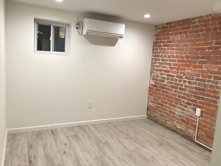 bedroom 2 with windows above the ground